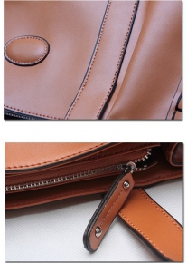 Эффектная сумка с заклепками из натуральной кожи